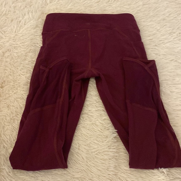 Athleta girls purple full length leggings. Mesh details on ankle and pockets. - Picture 2 of 4